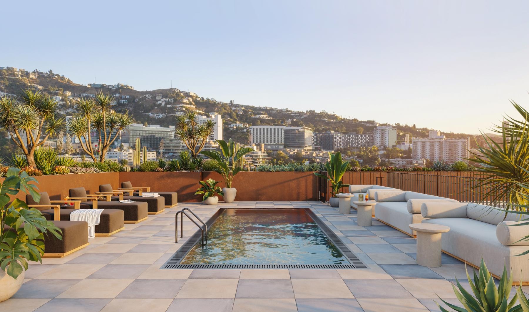 a pool with a city in the background