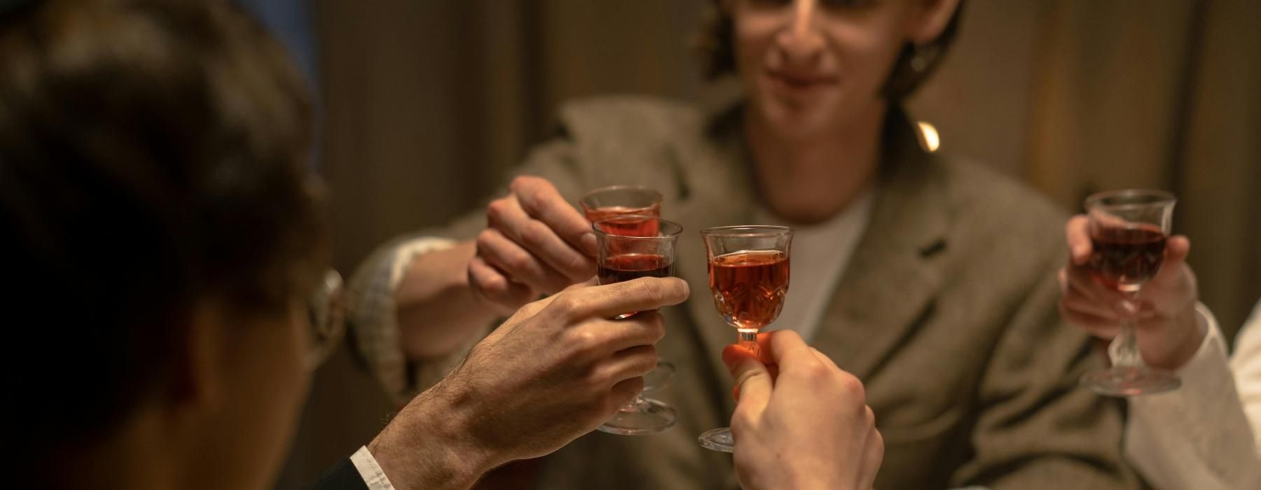 a person holding a glass of wine